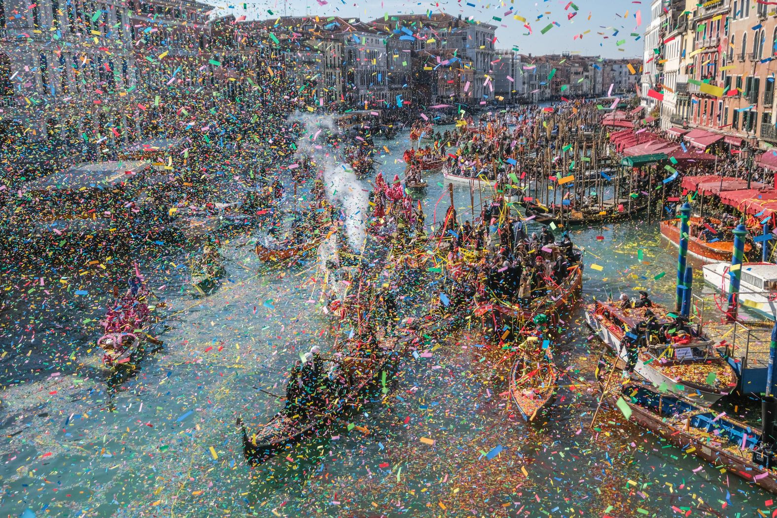 The Carnival regatta arrives near the Rialto Bridge in Venice, Italy, on Sunday, February 16.