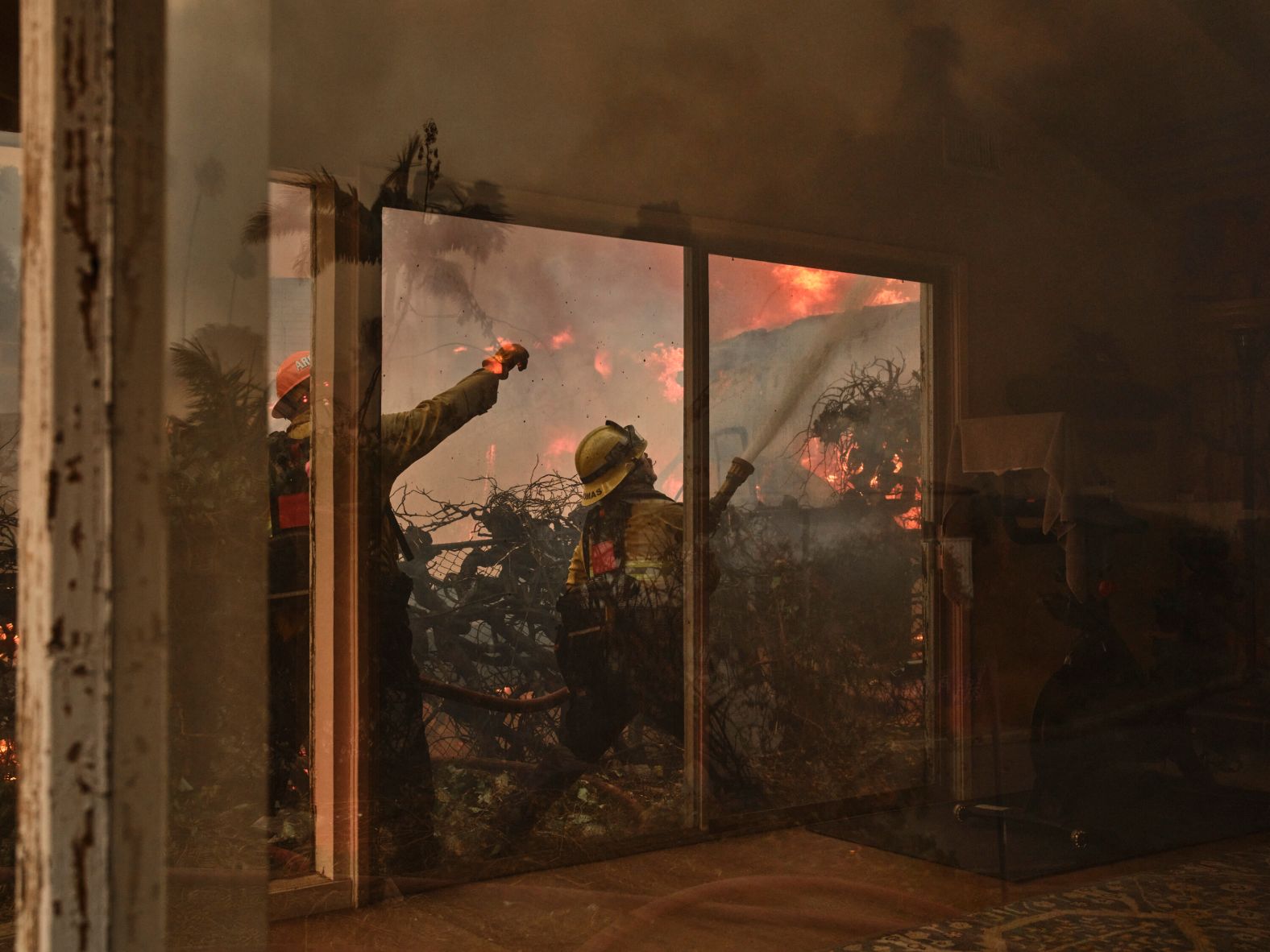 Firefighters battle the Palisades Fire in Los Angeles on Tuesday, January 7.