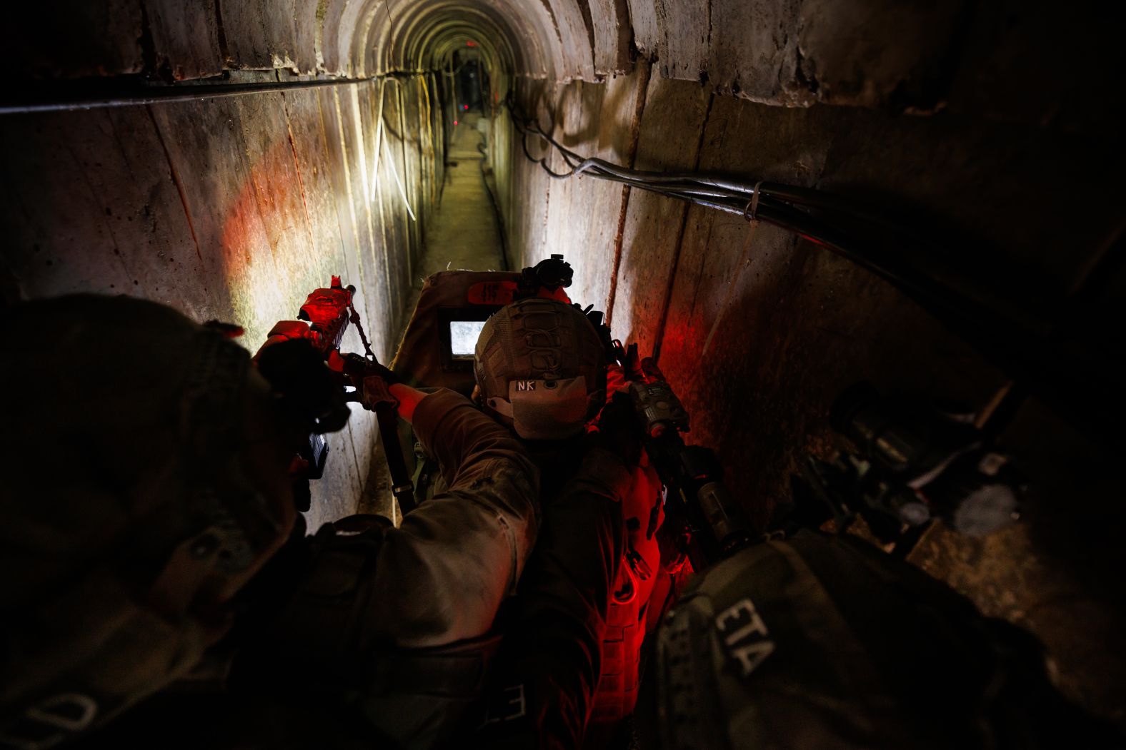 Israeli troops walk December 19 through what they said was an underground tunnel used by Hamas militants in Gaza. Weeks into Israel’s ground operation in Gaza, one of the key challenges facing its military <a href="https://www.cnn.com/2023/12/16/middleeast/israel-hamas-tunnel-flooding-tests-explainer-intl/index.html">was the labyrinth of Hamas tunnels</a> that it said spans the entirety of the Strip. “I was embedded with the Yahalom Unit,” photographer Ziv Koren said. “You were 10-15 meters underground. It was very, very hot. You sweat a lot, it was hard to breathe. The tunnels were a complicated structure. Some tunnels had electricity, locked rooms, folding beds and toilets.”