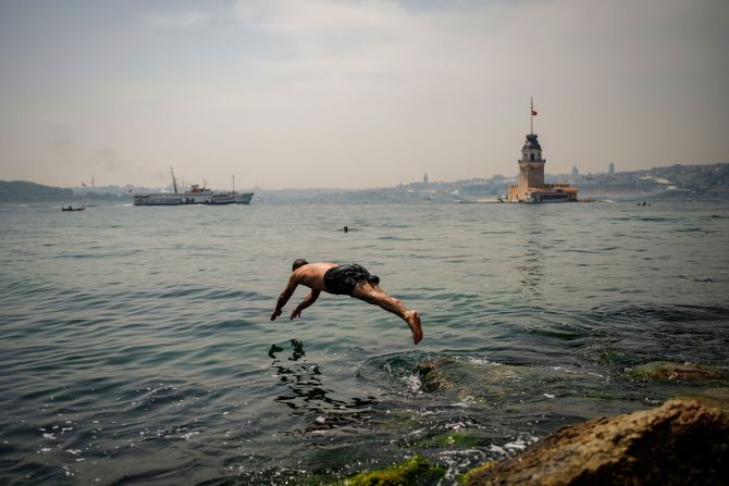 A man dives into the Bosphorus during a hot day in Istanbul on Thursday, June 13.