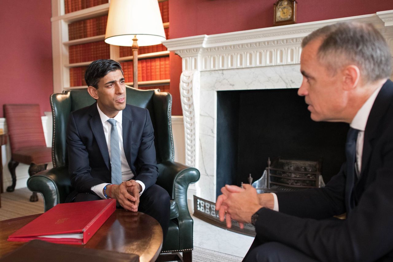 Britain's Chancellor of the Exchequer Rishi Sunak, left, speaks with Mark Carney, Governor of the Bank of England in London, England, on March 11.