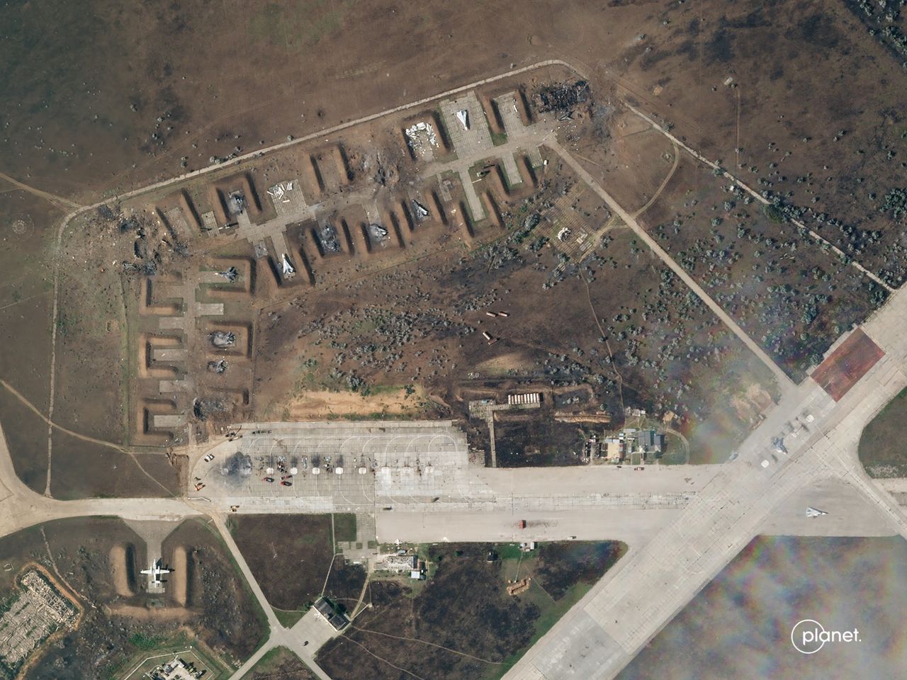 A satellite image from August 10 shows the charred remains of at least seven aircraft after explosions at Saki air base.?