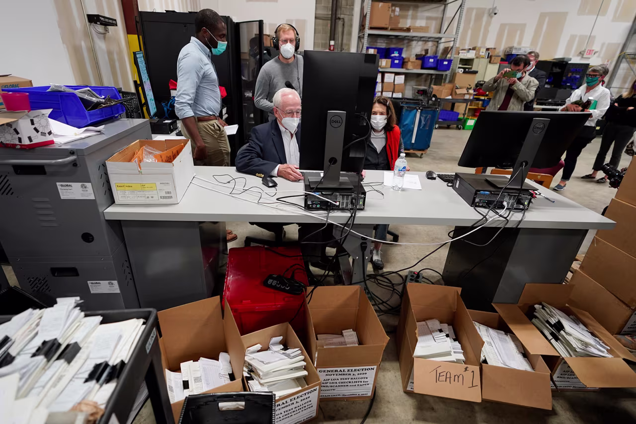 Democratic and Republican representatives review absentee ballots at the Fulton County Election preparation Center in Atlanta, on November 4.