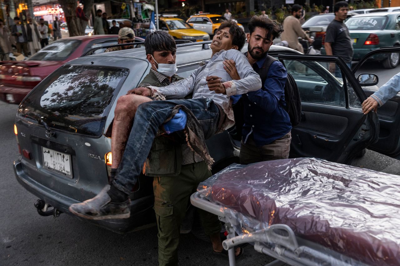 A person wounded in a bomb blast outside the Kabul airport in Afghanistan on Thursday, Aug. 26, arrives at a hospital in Kabul.