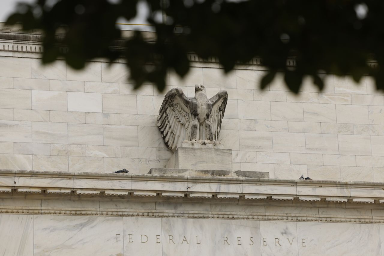 A statue of an eagle is seen on the Federal Reserve building on September 17 in Washington, DC.