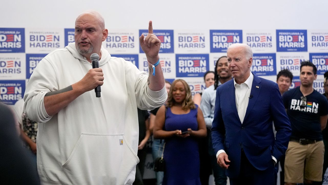 President Joe Biden, right, listens as Sen. John Fetterman speaks at a campaign office in Philadelphia, Pennsylvania on July 7.