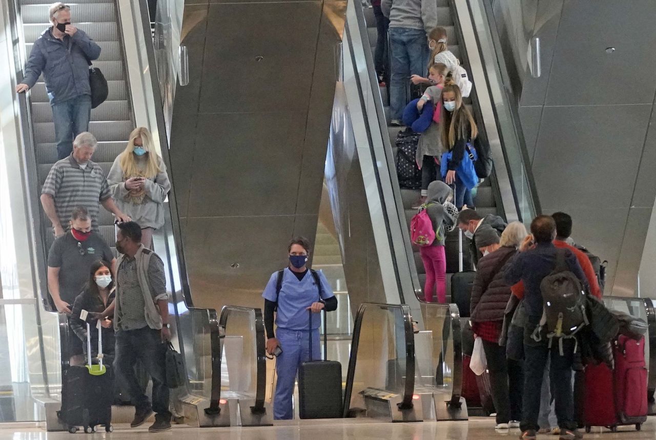 Travelers are seen at Salt Lake City International Airport in Utah, on Wednesday, March 17. 