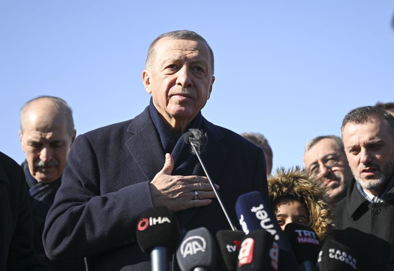 Turkish President Recep Tayyip Erdogan speaks to the press at a tent city set up for quake survivors in Kahramanmaras on February 8. 