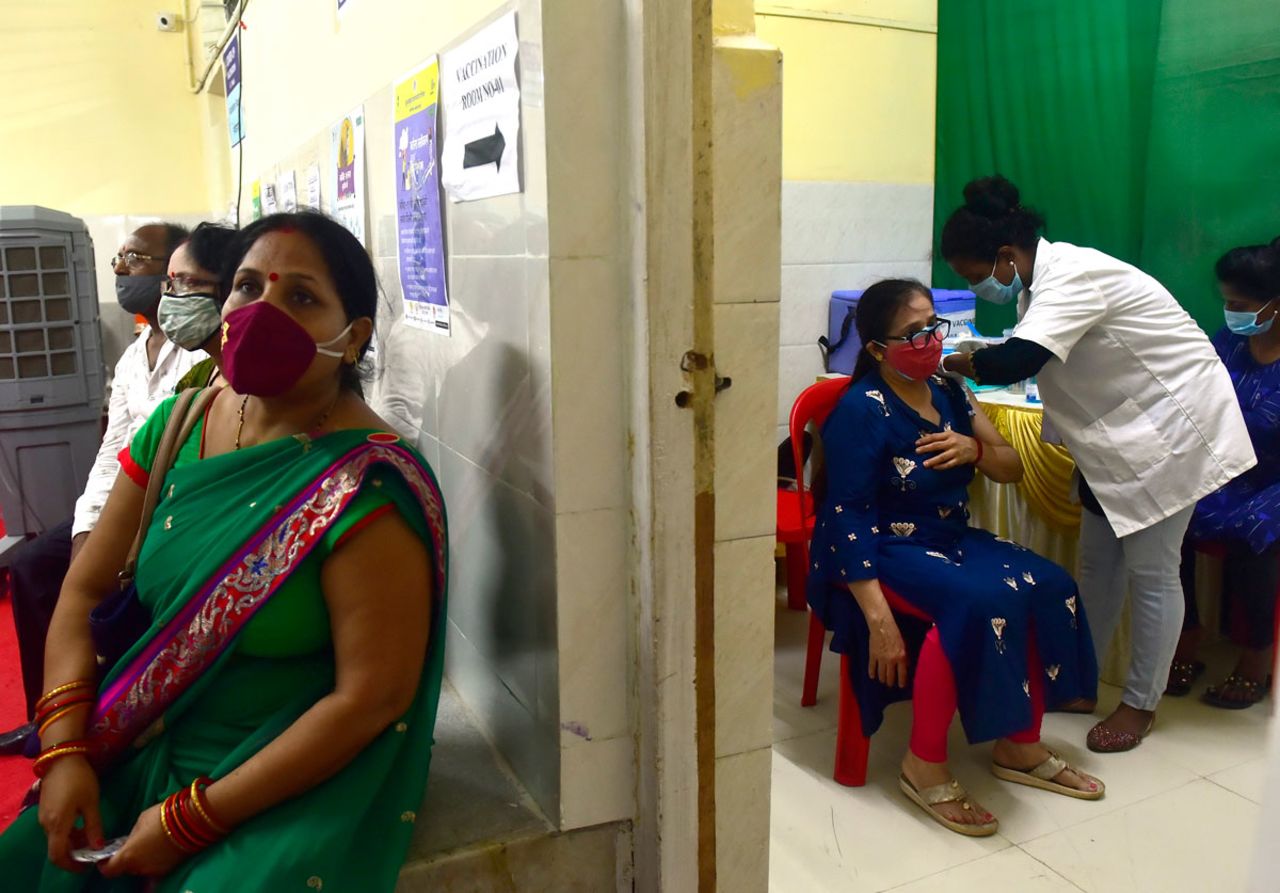 A BMC medical staff member administers a dose of the Covid-19 vaccine at the Urban Health Training Centre on April 3 in Mumbai, India.