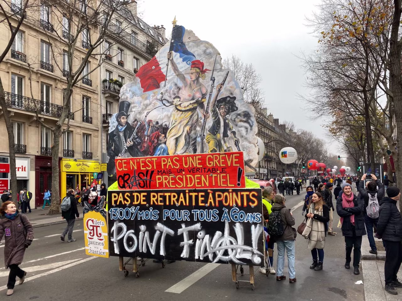 Protesters carry a red sign reading "This is not a strike but a true presidential crash" on Thursday. 