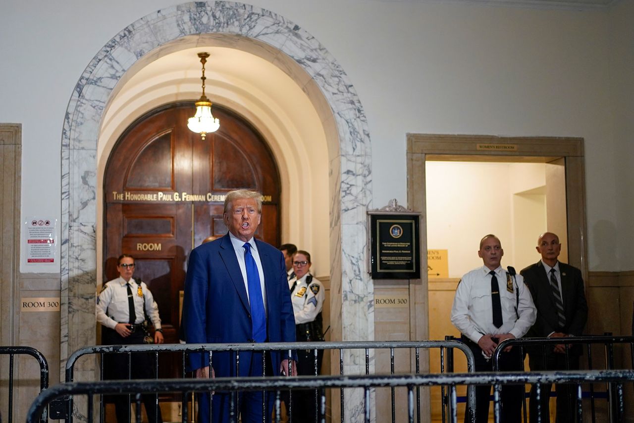 Former President Donald Trump speaks before entering the courtroom on Wednesday.