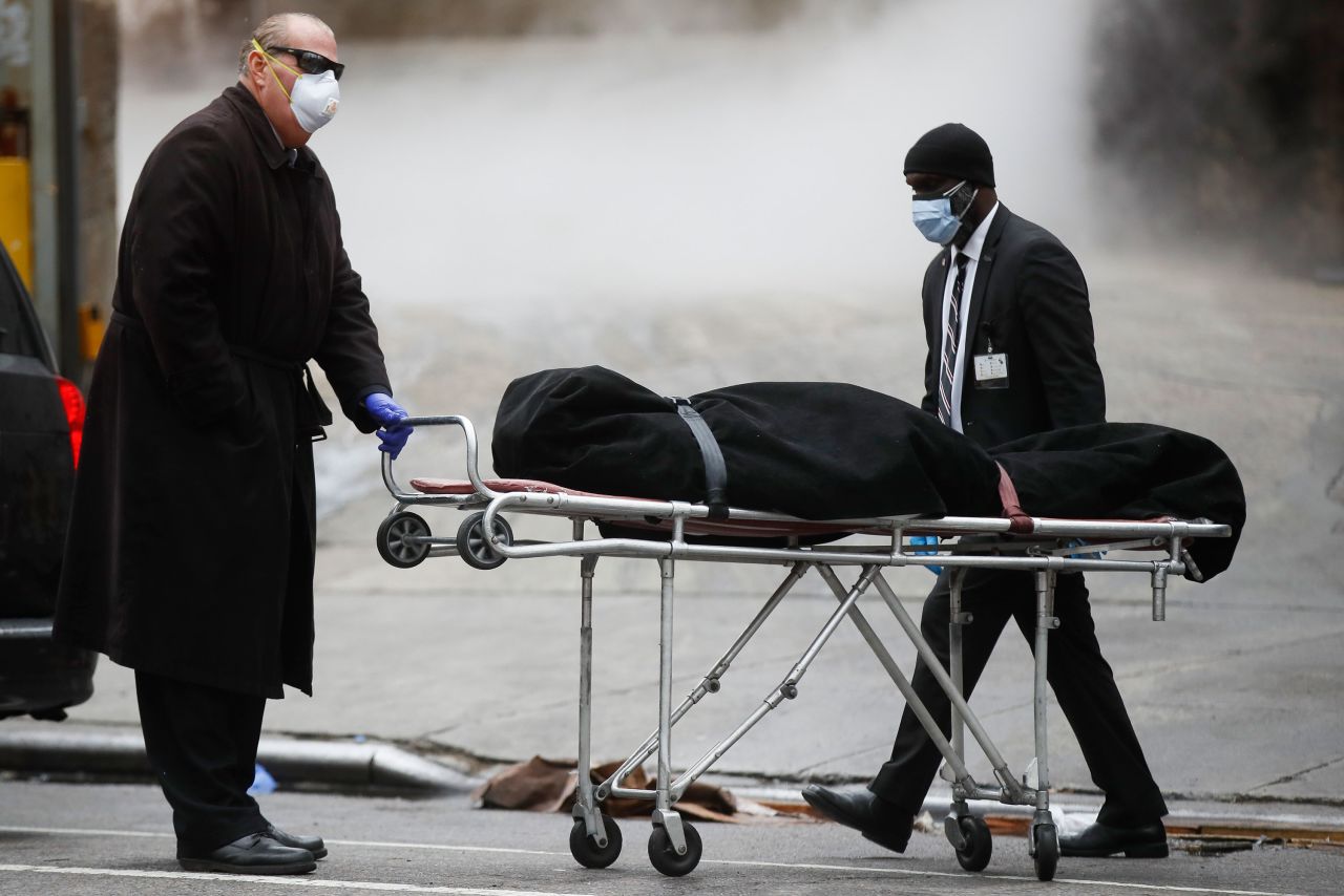 A funeral director collects a body from The Brooklyn Hospital Center in New York on April 9.