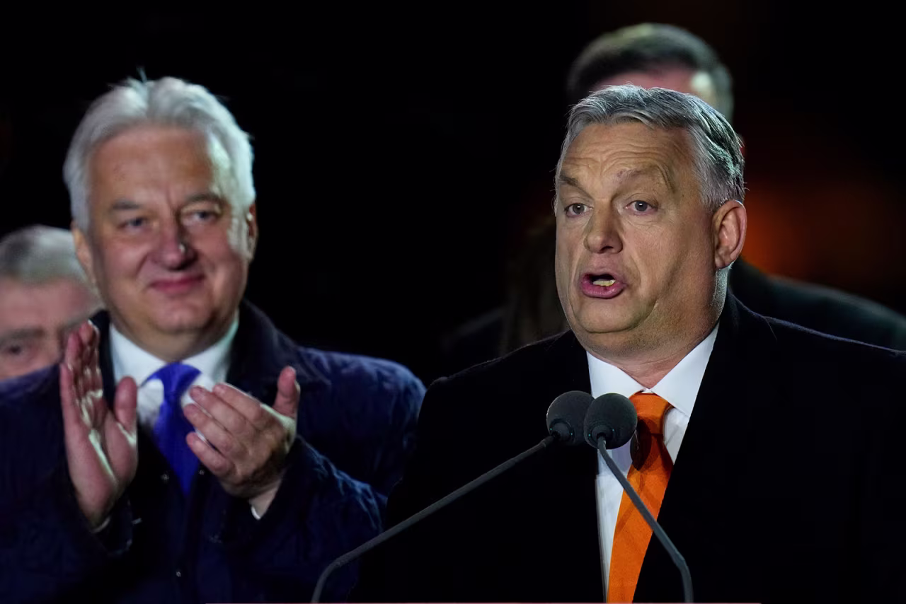 Hungary's Viktor Orban addresses cheering supporters during an election night rally in Budapest, Hungary, on Sunday.