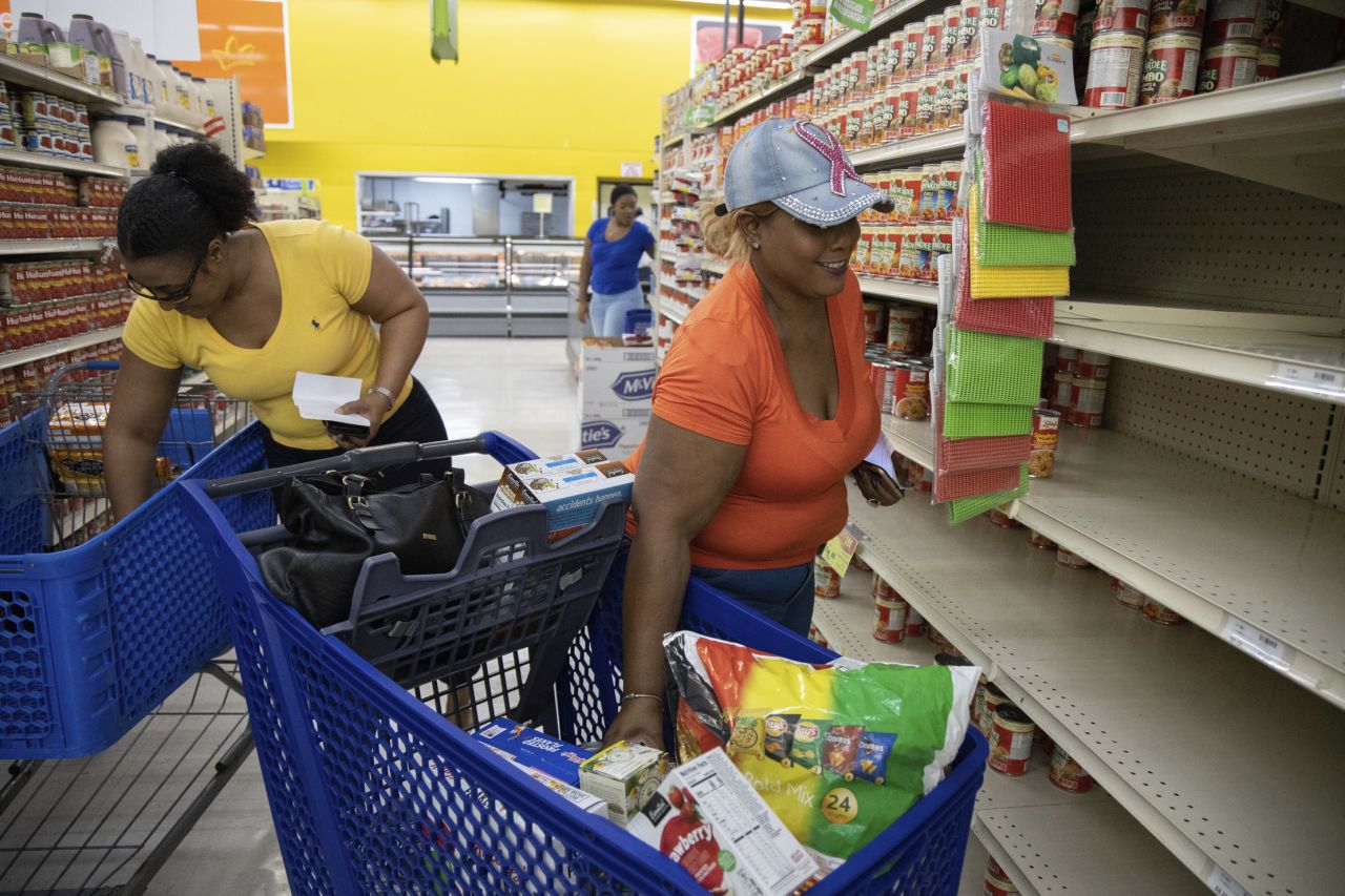 People shop for supplies in Freeport, Bahamas, on Friday before the arrival of Dorian.