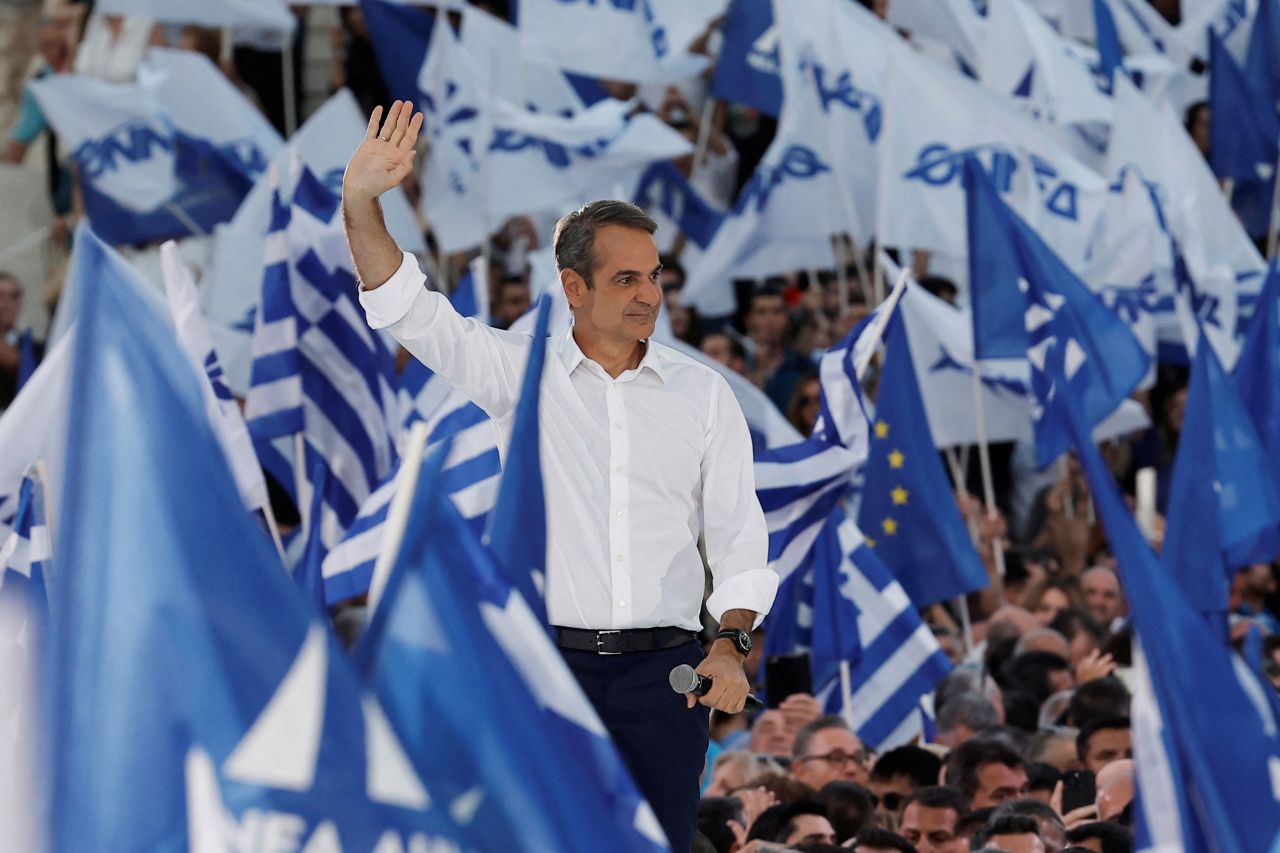 Greek Prime Minister and leader of the New Democracy ruling party Kyriakos Mitsotakis waves at supporters during a pre-election rally in Athens, Greece, on June 7.