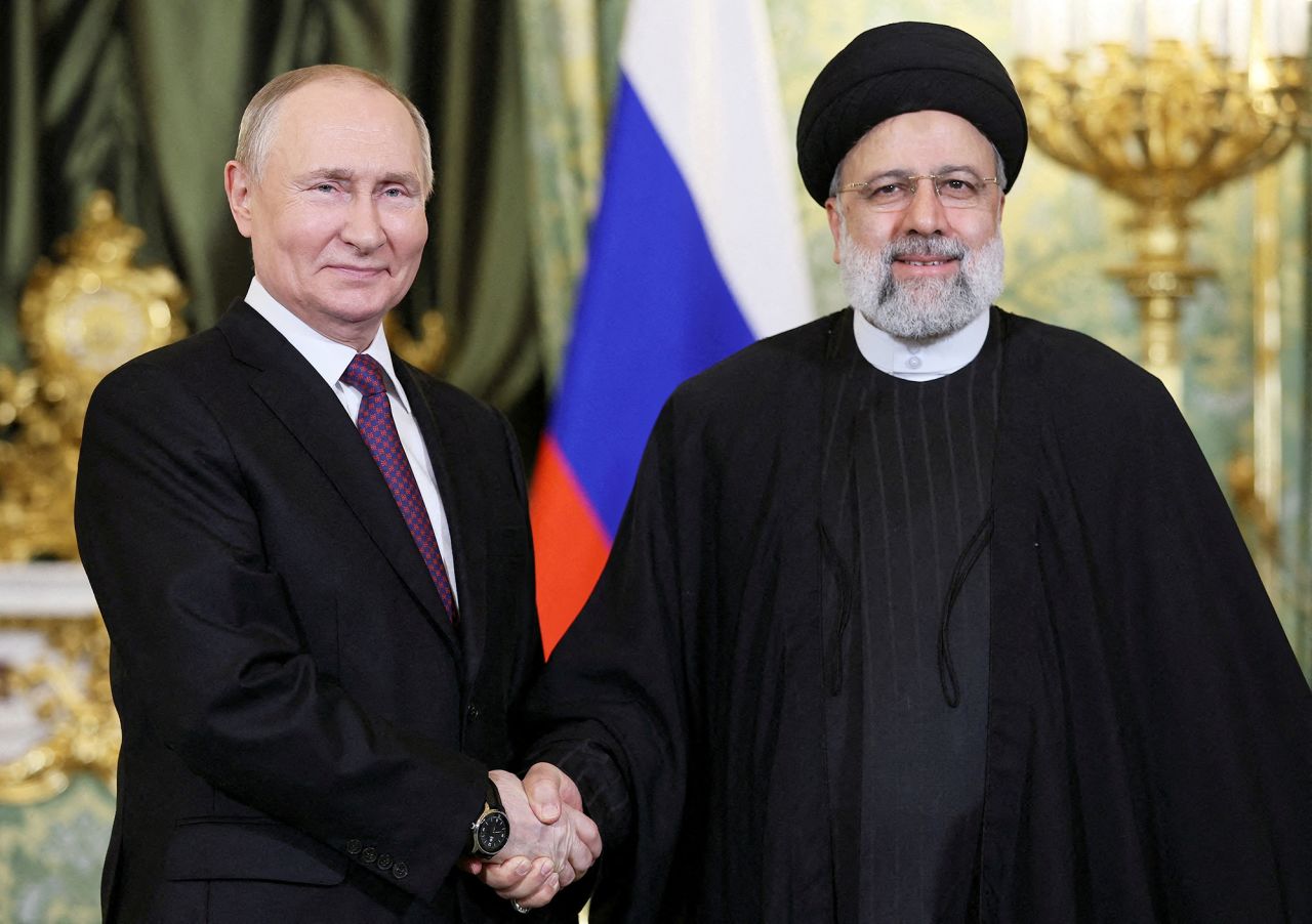 Russian President Vladimir?Putin, left,?shakes hands with Iranian President Ebrahim?Raisi?during a meeting in Moscow, Russia, on December 7, 2023. 