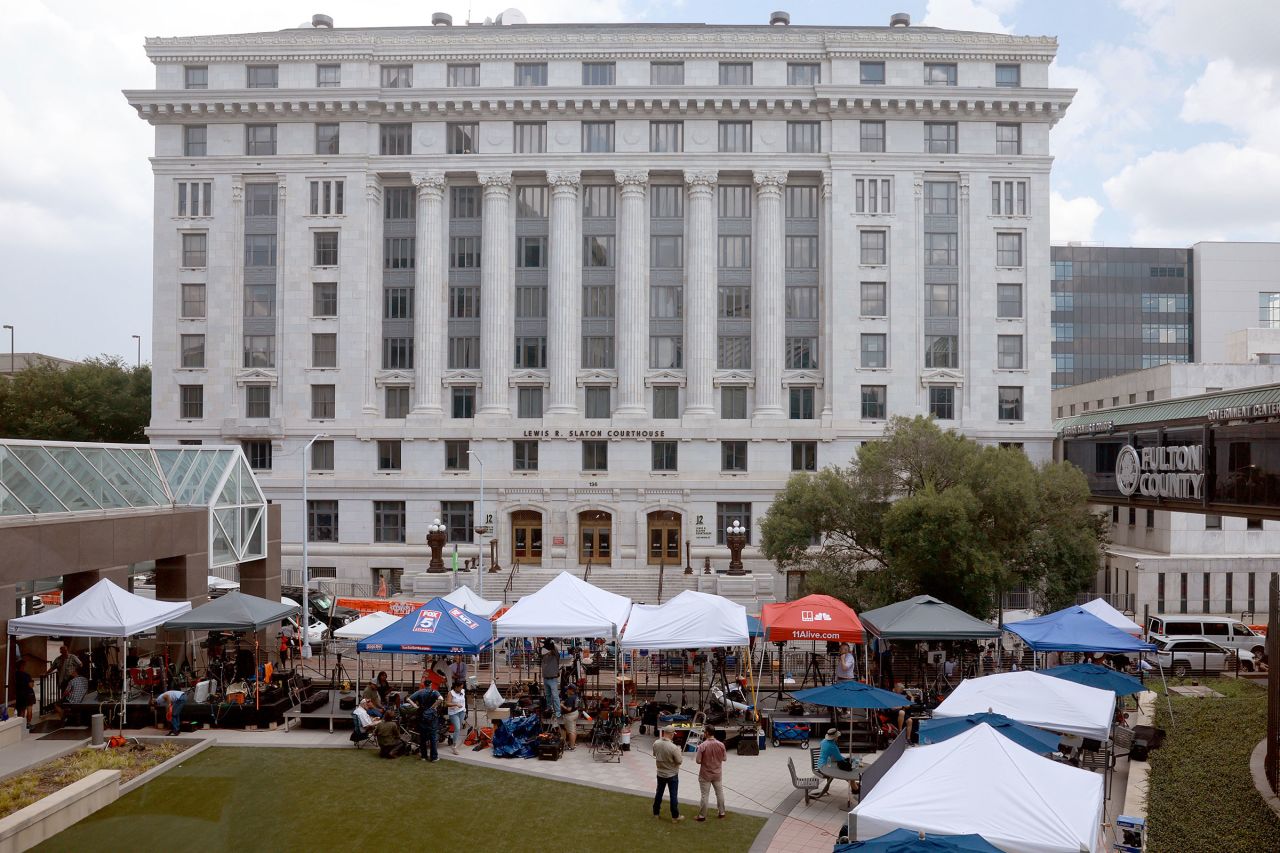 Media camps out in front of the Fulton County Courthouse on August 14, 2023 in Atlanta, Georgia.