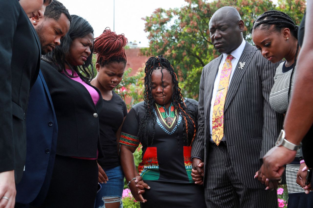 Tamika Palmer, Breonna Taylor's mother, prays with Taylor's sister Ju'Niyah Palmer, left, attorney Ben Crump, right, and Until Freedom members after the announcement that four current and former Louisville police officers involved in the deadly raid on Taylor's home were charged with civil rights violations and other counts August 4, 2022, in Louisville, Kentucky. 