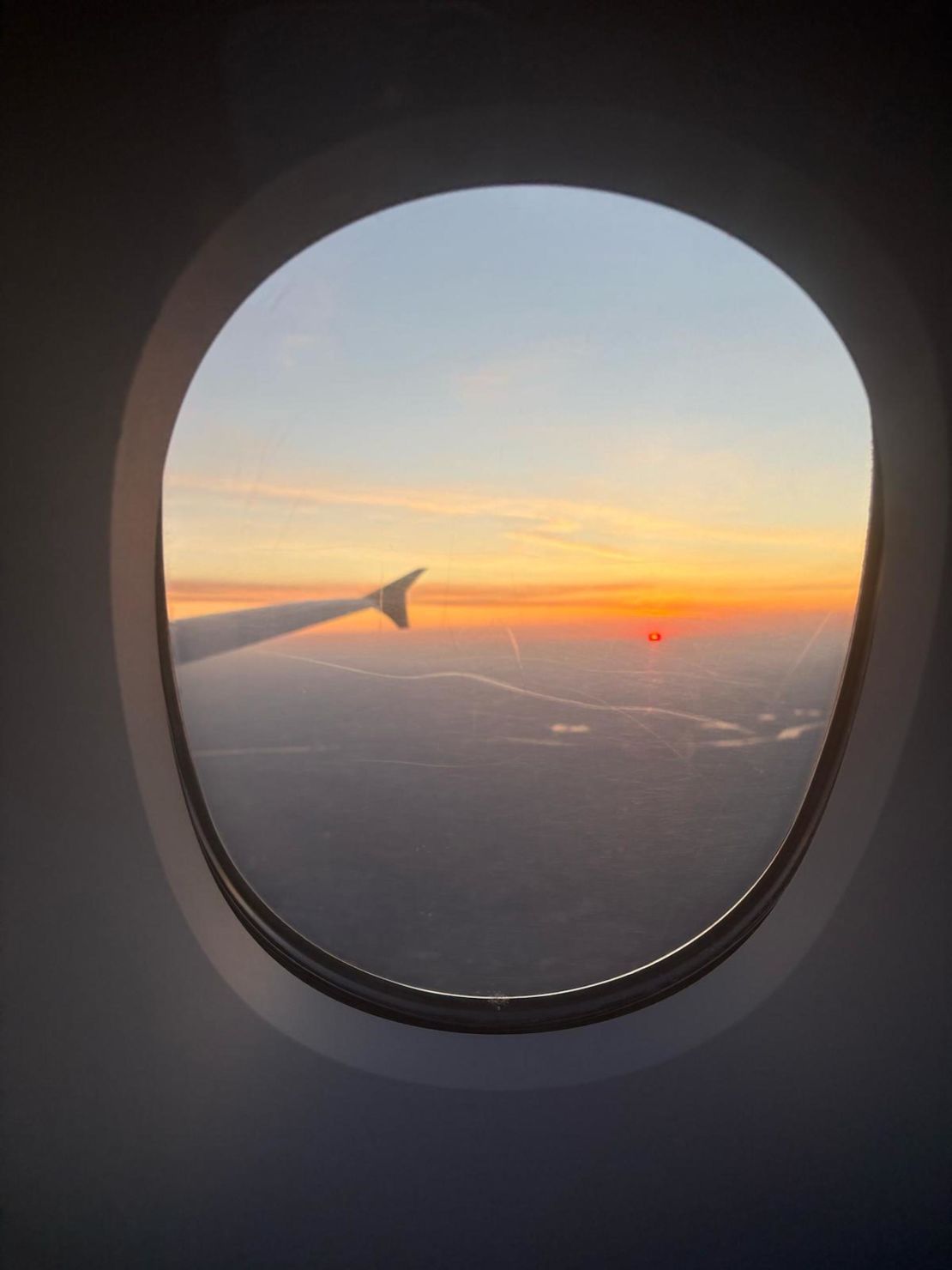 Billie and Richard’s return from their honeymoon was disrupted by the London Heathrow Airport shutdown. Billie took this photo of "the lovely sunrise as I realized we were landing in Germany."