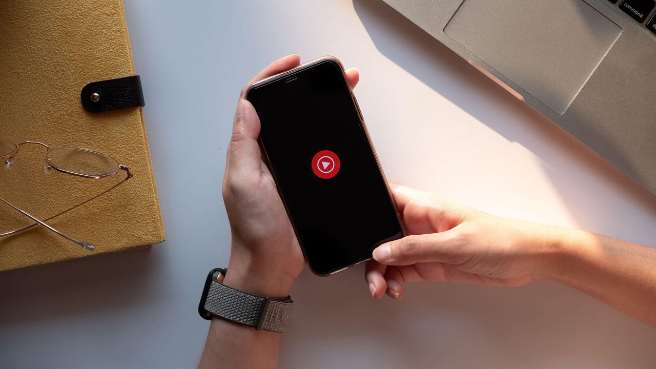 An iPhone Xs with Youtube Music's logo.