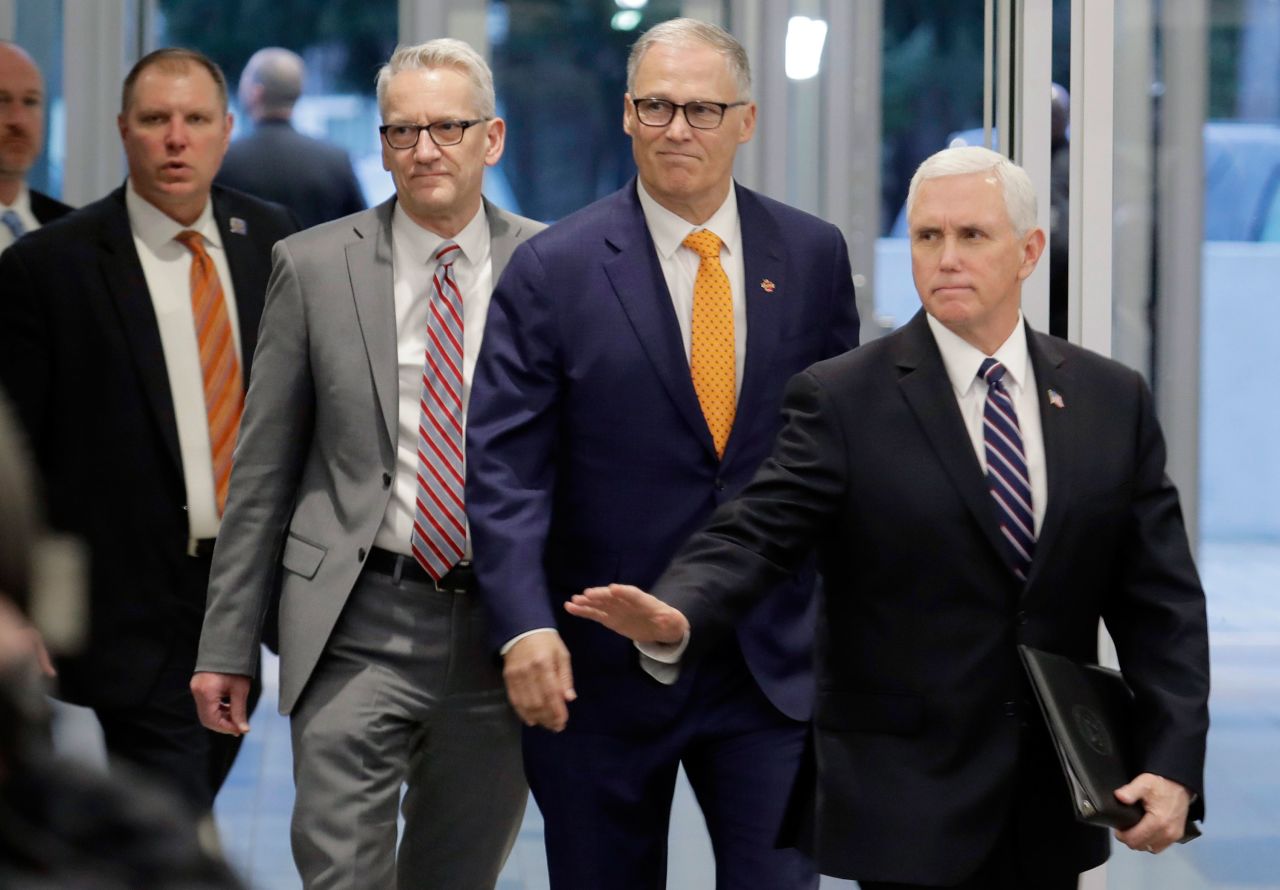 Vice President Mike Pence arrives for a news conference at Camp Murray in Washington on Thursday. 