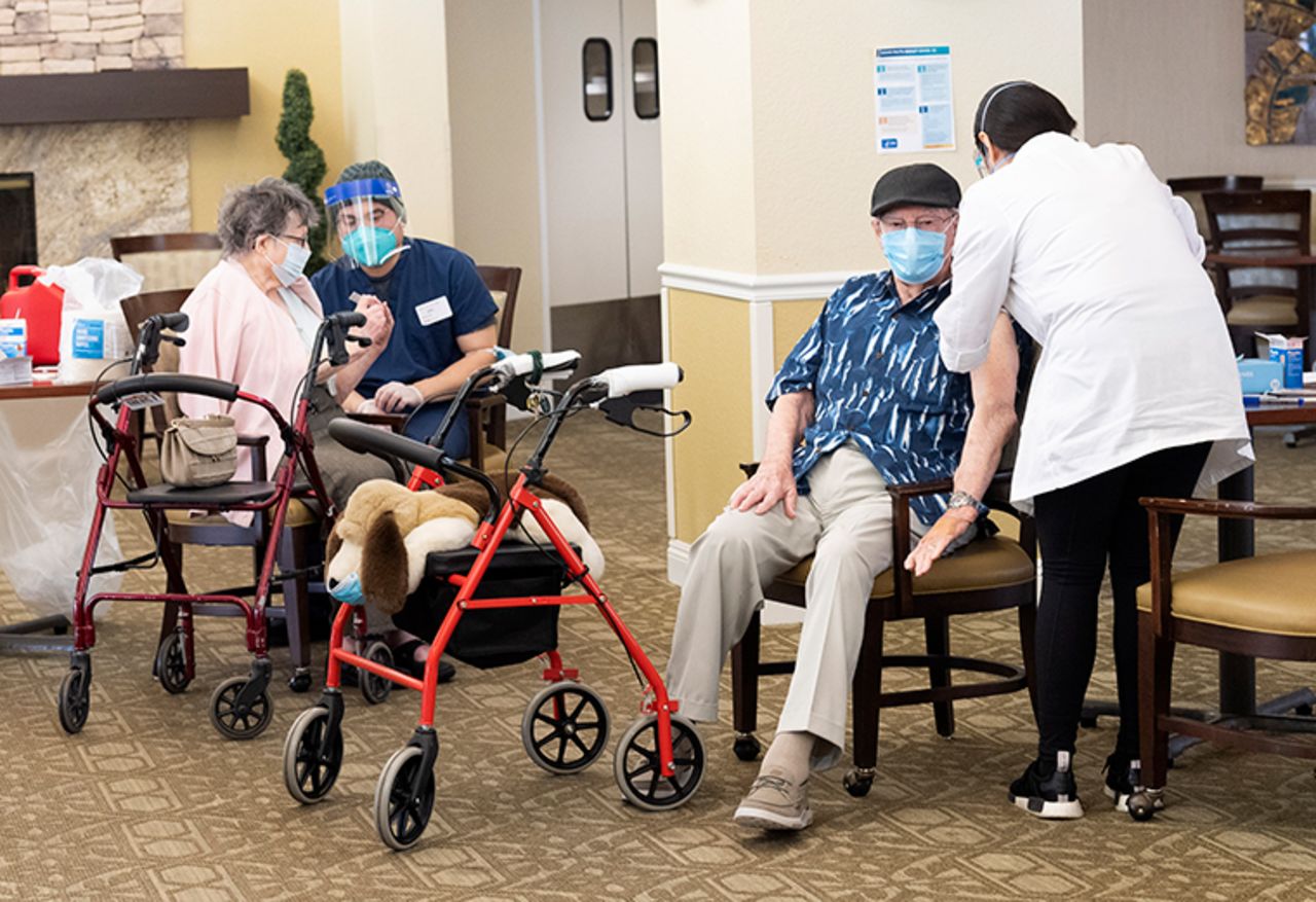 Residents get the Pfizer/BioNTech COVID-19 vaccine at the Emerald Court senior living community in Anaheim, California on Friday, January 8.