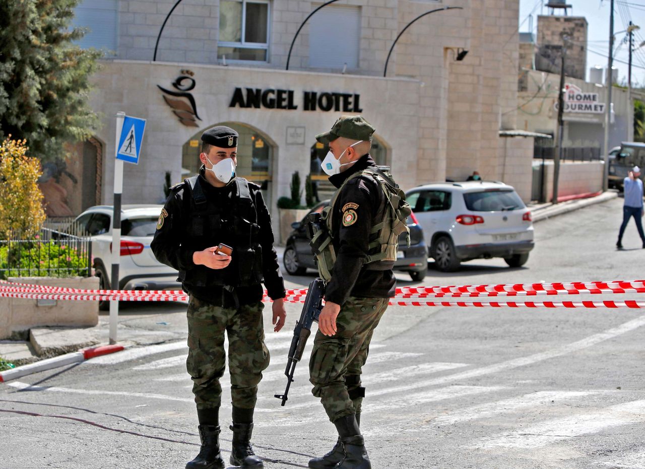 Security forces seal off a hotel in the town of Beit Jala, following suspected cases of coronavirus on March 5. 