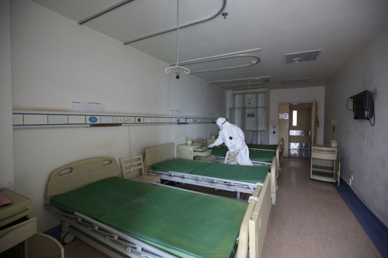 A worker disinfects a room at the Red Cross hospital in Wuhan, in China's central Hubei province on March 18.