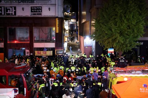 Rescue teams and firefighters at the scene where at least 149 people died in a crowd surge during Halloween celebrations in Seoul, South Korea, on Oct. 30.