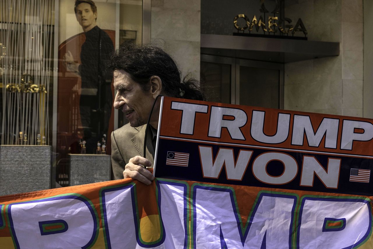 A supporter of former President Donald Trump holds a "Trump Won" sign outside of Trump Tower in New York on Monday, April 3. 