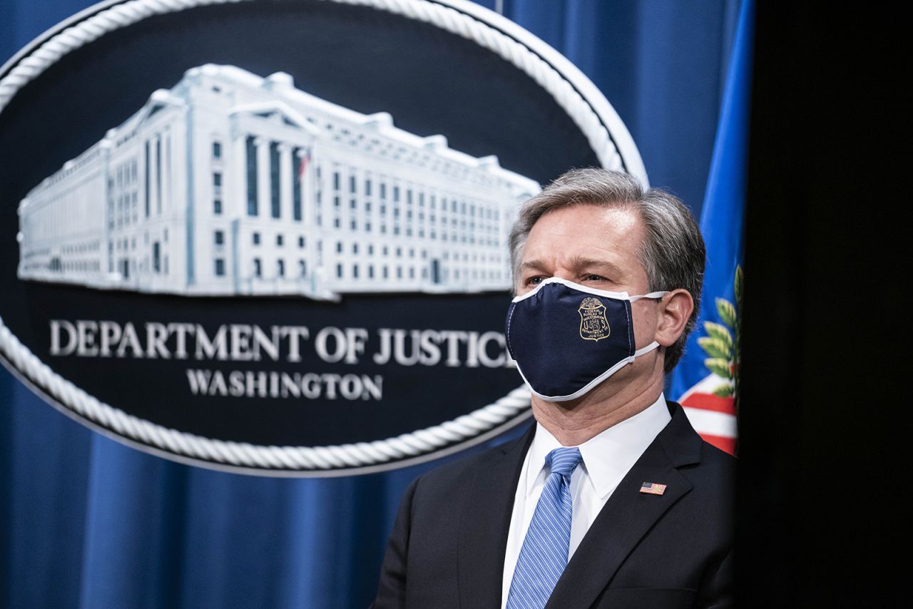 FBI Director Christopher Wray takes part during a virtual news conference at the Department of Justice on October 28, 2020 in Washington.