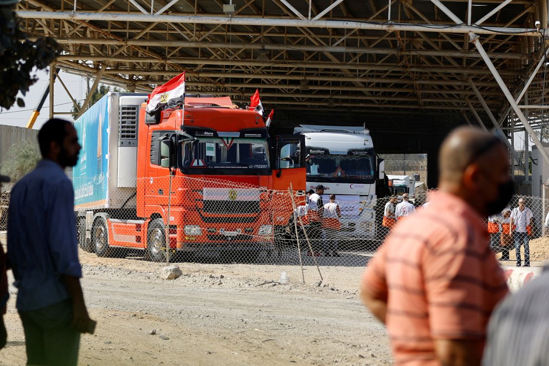 Trucks carrying aid arrive at the Palestinian side of the border with Egypt in Rafah in southern Gaza, on October 21.