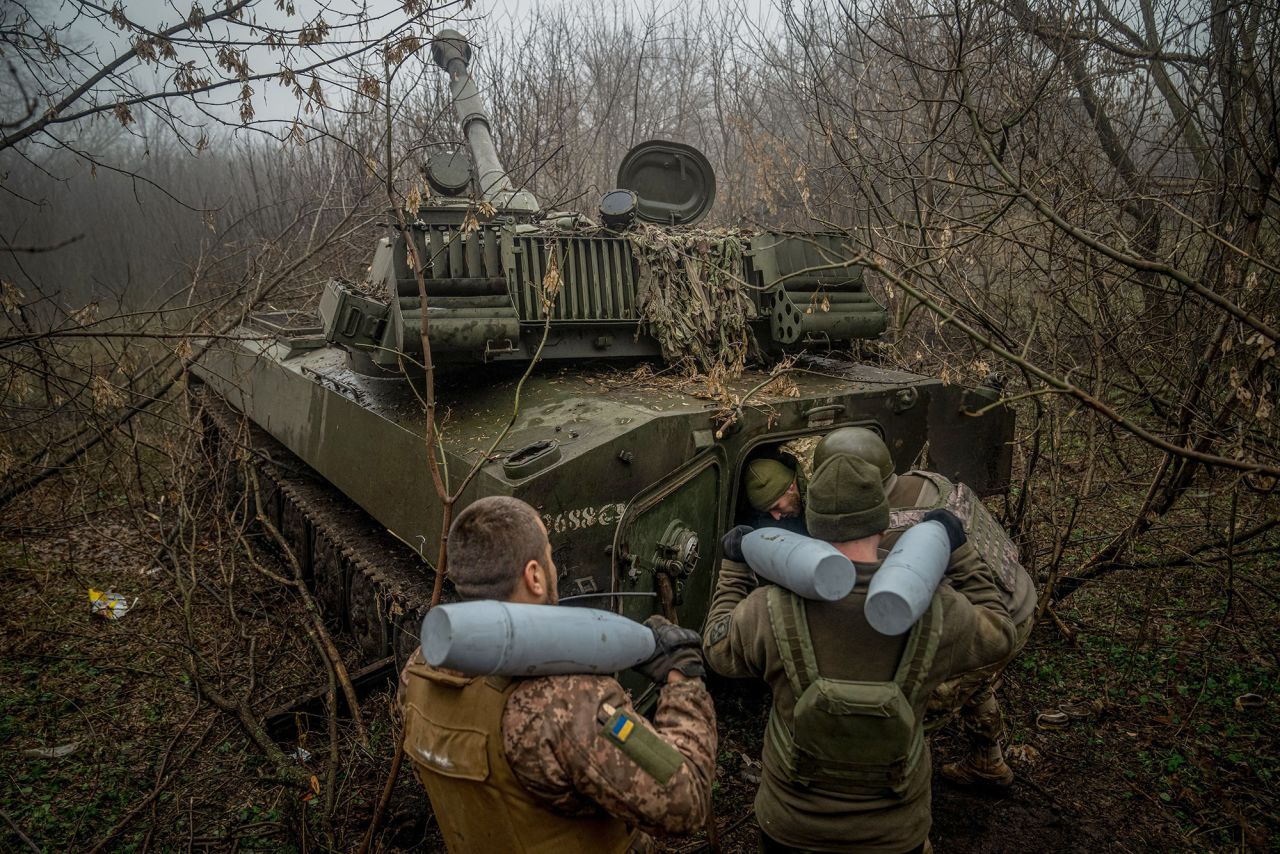 Ukrainian artillerymen from the 24th brigade load an ammunition inside of a 2S1 Gvozdika self-propelled howitzer at a position along the front line in the vicinity of Bakhmut, Donetsk region, on December 10.