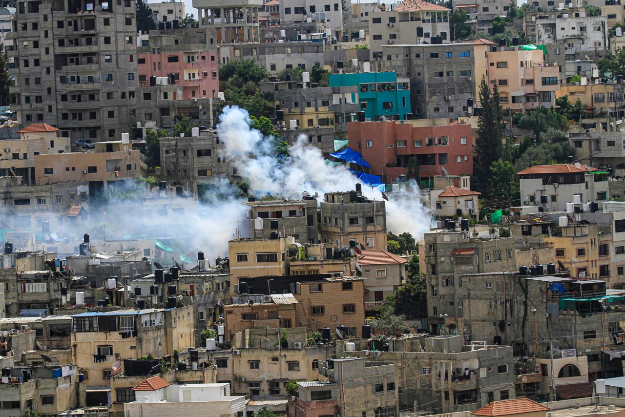 Heavy smoke seen rising from several buildings in Nour Shams Palestinian refugee camp, near Tulkarm in the northern West Bank, on October 19. 