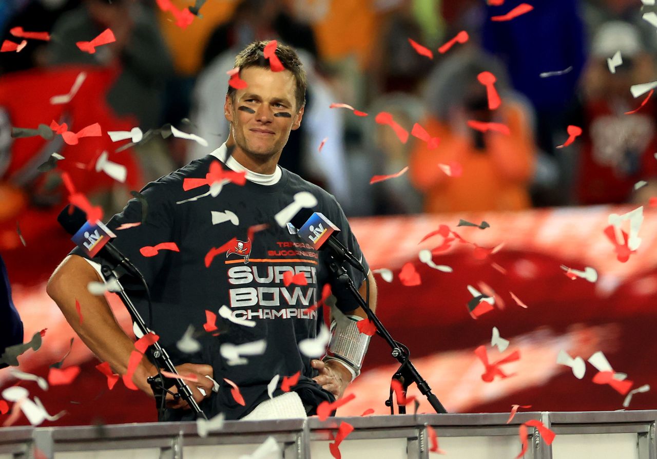 Tom Brady stands on the winners' podium after winning Super Bowl LV in 2021 in Tampa.