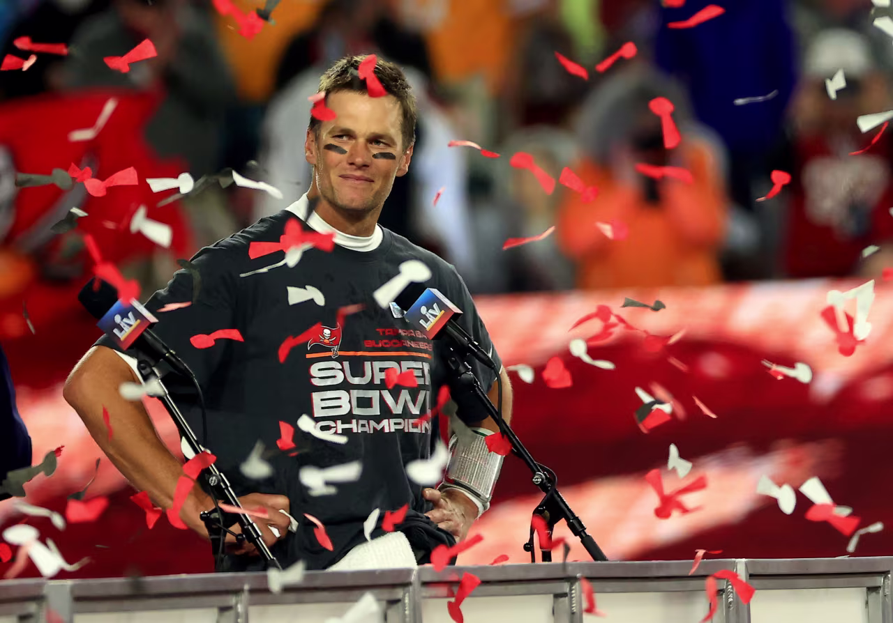 Tom Brady stands on the winners' podium after winning Super Bowl LV in 2021 in Tampa.