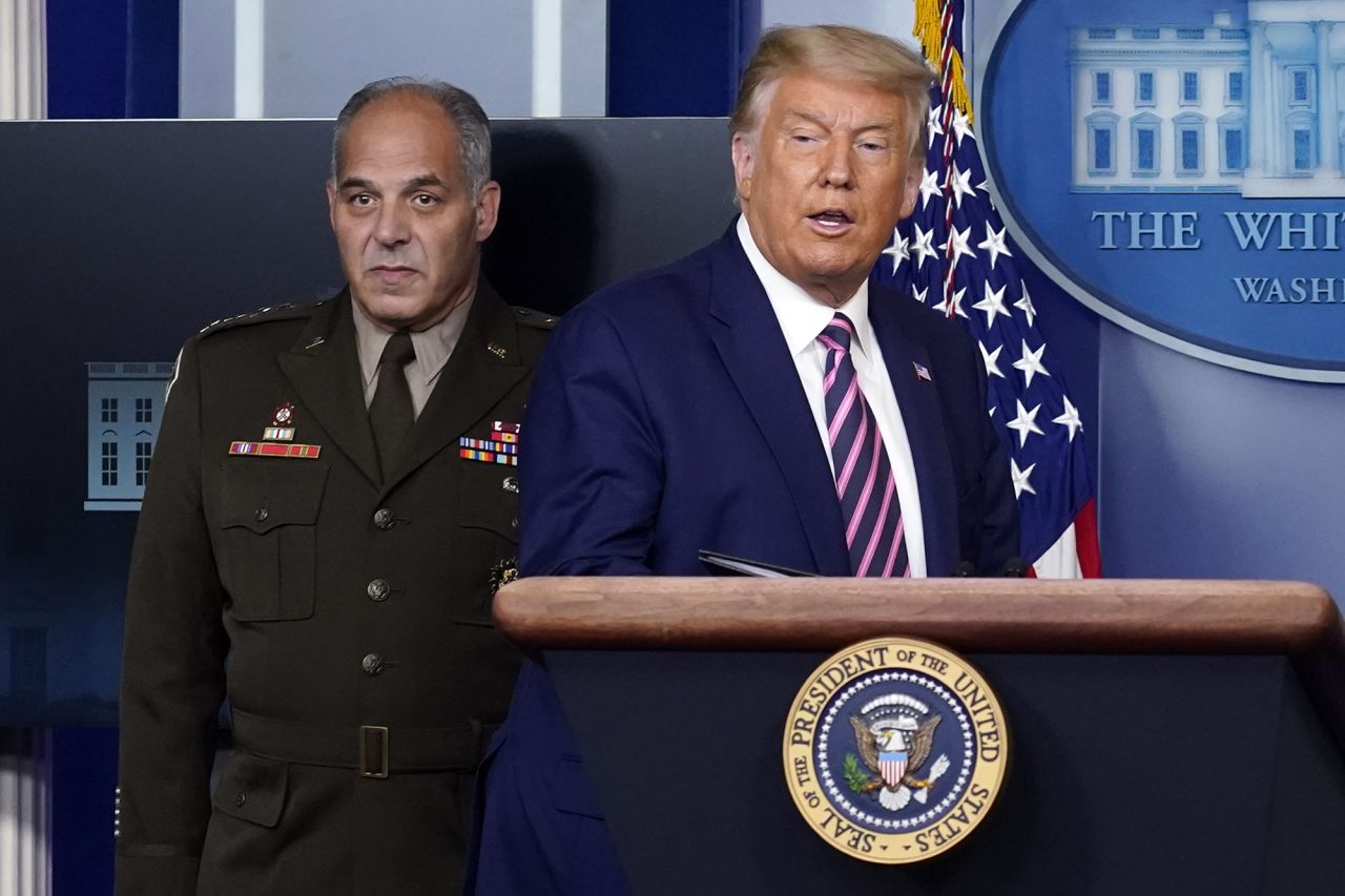 President Donald Trump arrives to speak at a news conference in the James Brady Press Briefing Room of the White House on Friday in Washington.