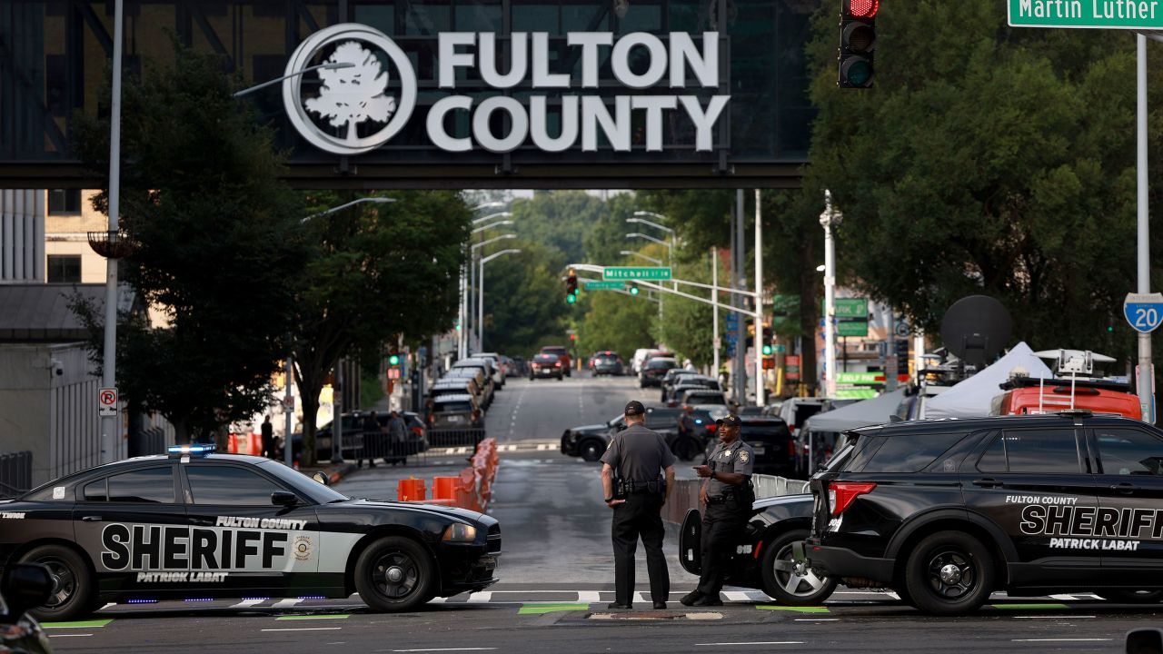 Fulton County Sheriff officers block off a street in front of the Fulton County Courthouse on August 7, 2023 in Atlanta, Georgia. 