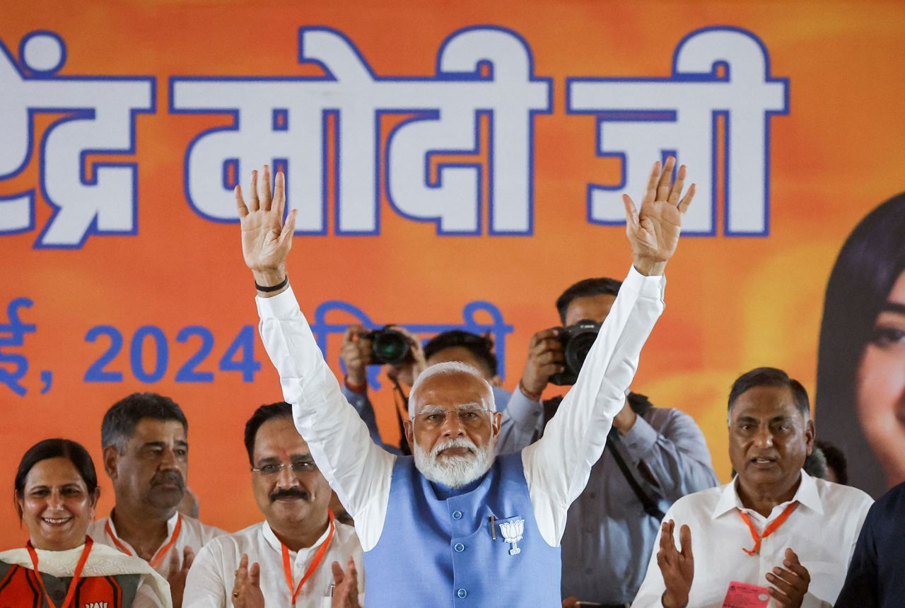 India's Prime Minister Narendra Modi gestures to his supporters during an election campaign rally, in New Delhi, India, on May 22.