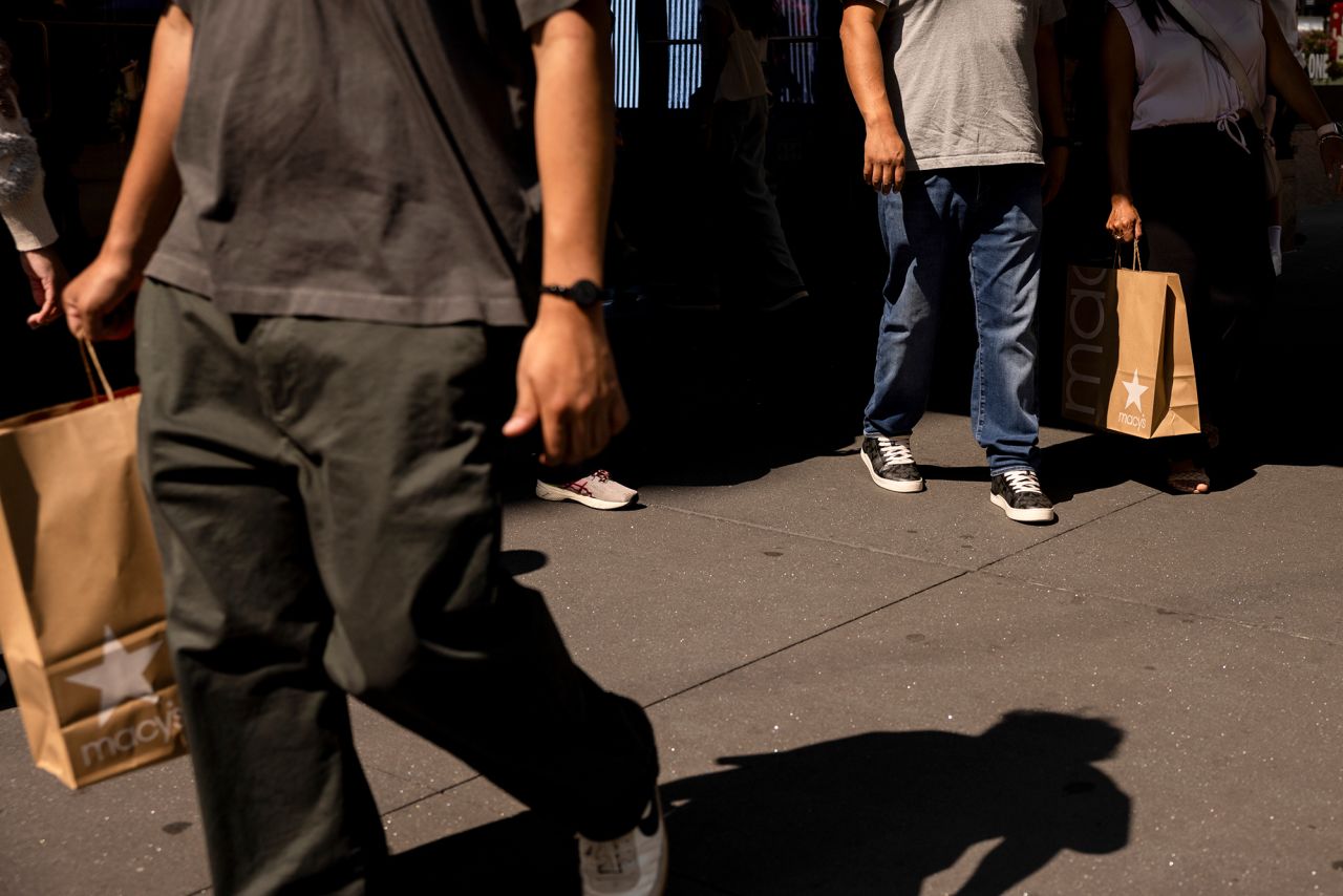 Shoppers carry bags in New York City on Friday, September 13.