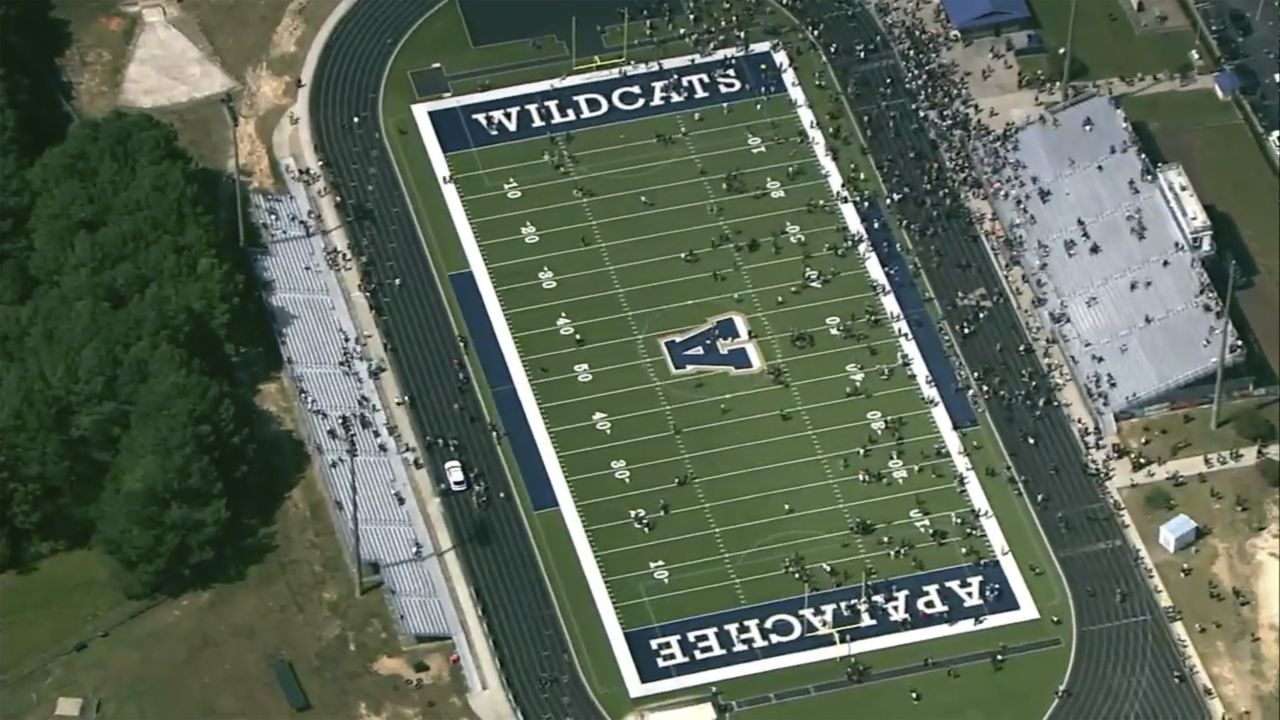  Students are evacuated to the football stadium after the school campus was placed on lockdown at Apalachee High School in Winder, Georgia, on Wednesday.