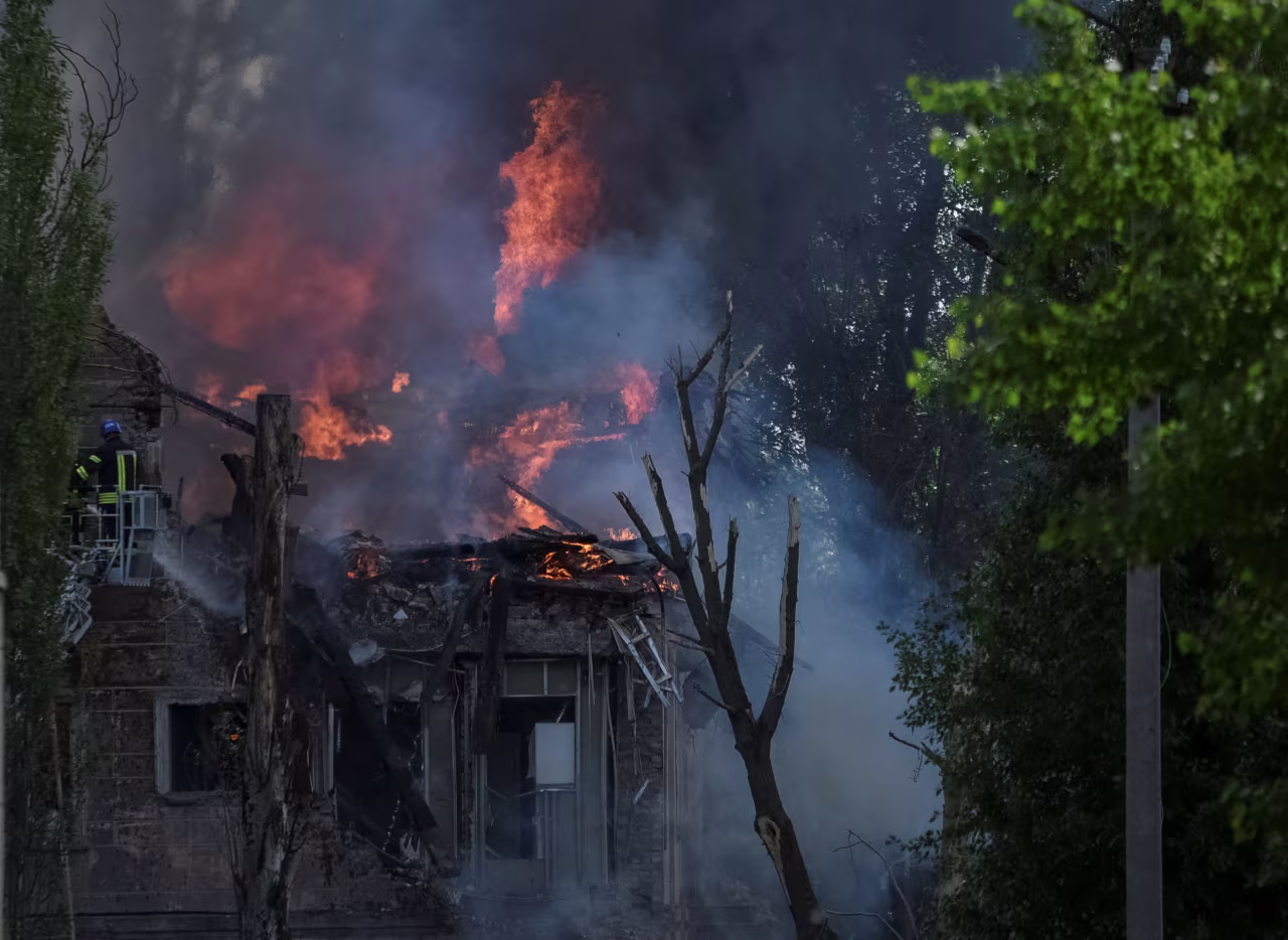 A fire fighter works at the site of a clinic which was destoryed by a Russian missile strike in Dnipro, Ukraine, on Friday.