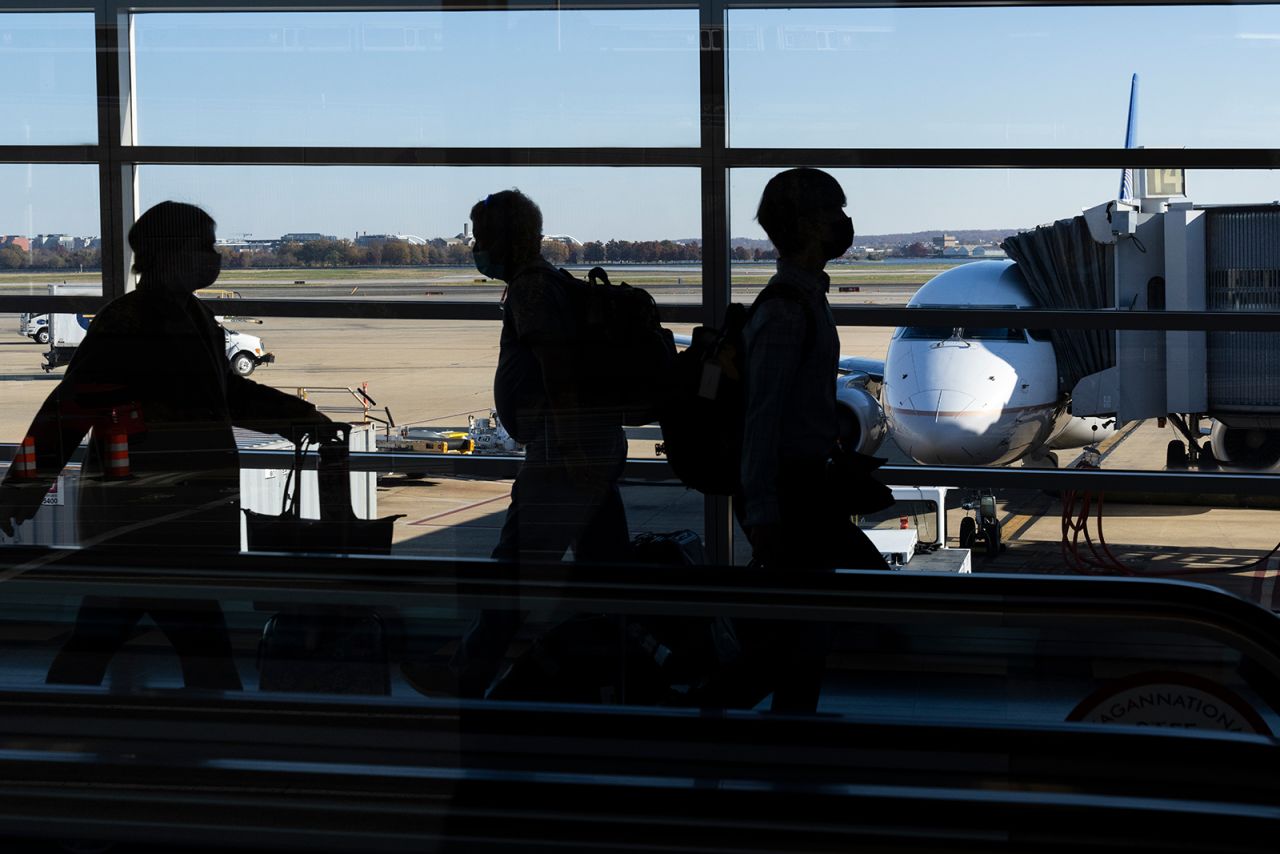 Travelers walk through Terminal A at Ronald Reagan Washington National Airport November 23, in Arlington, Virginia. 