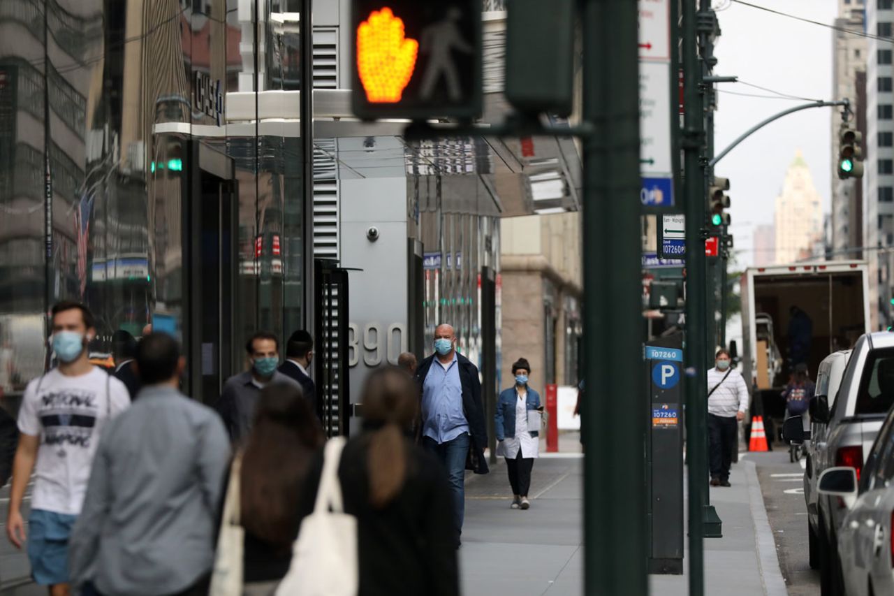 People walk through Manhattan, New York on October 21.