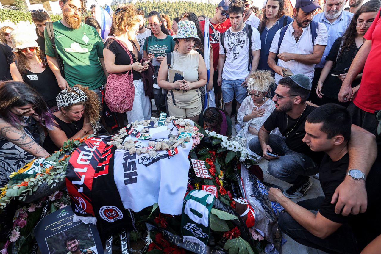 Mourners gather by the grave of American-Israeli citizen Hersh Goldberg-Polin during the funeral in Jerusalem on Monday.