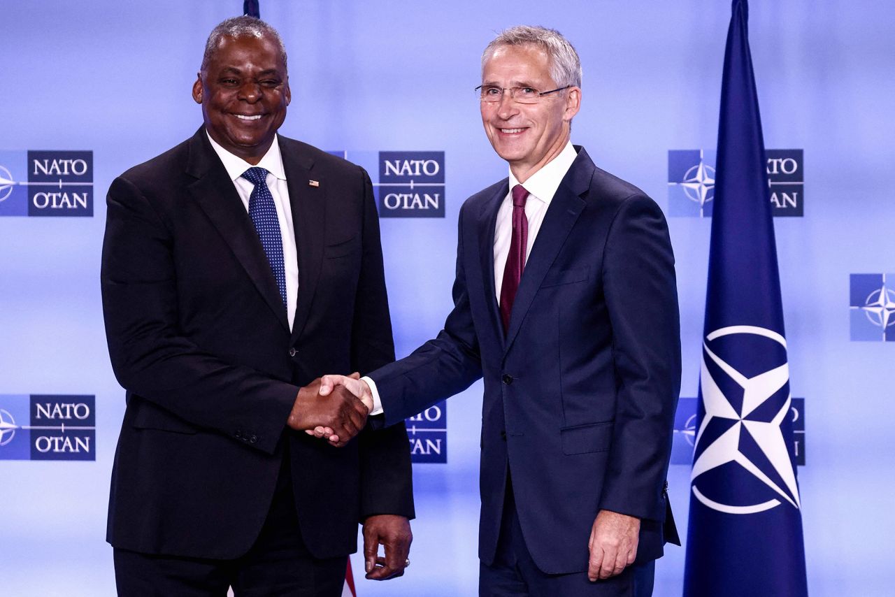 US Defense Secretary Lloyd Austin, left, shakes hands with NATO Secretary General Jens Stoltenberg during a news conference on the second day of a meeting of the alliance's defense ministers at NATO headquarters in Brussels, on October 13.