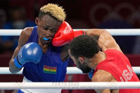 The United States' Duke Ragan, right, exchanges punches with Ghana's Samuel Takyi during their men's featherweight 57-kg semifinal boxing match on Tuesday.
