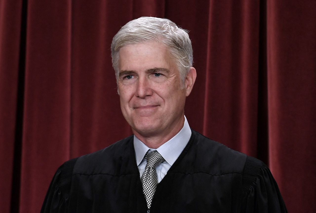 Justice Neil Gorsuch poses for photos in Washington, DC, in 2022.