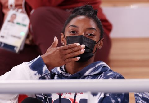 Simone Biles blows a kiss while watching the men's All-Around Final on day five of the Tokyo 2020 Olympic Games at Ariake Gymnastics Centre on July 28, 2021 in Tokyo, Japan.