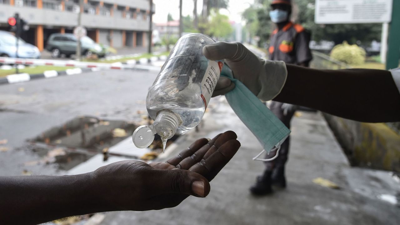 A visitor sanitizes their hands before being allowed into a state hospital at Yaba in Lagos, Nigeria on February 28.